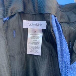 Boy dressed up pants.